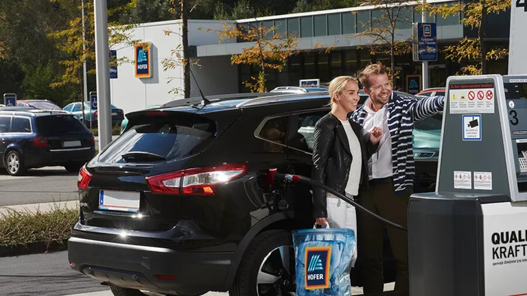 Woman filling up her car